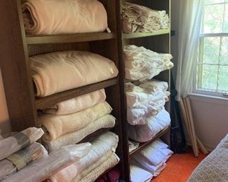 Sets of sheets and blankets almost completely king size.