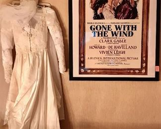 vintage wedding gown and a framed "Gone with the Wind" movie poster.