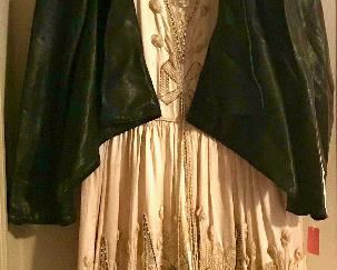 Stunning and fragile antique dress with lace, beading and rhinestones. Avant-garde black leather jacket by Vivienne Westwood.