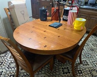 Nice oak table and four chairs in the man cave lower level