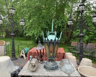 Outside antique lighting
Notice the pair of three armed street lights?