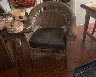 Antique wicker chair with leather seat