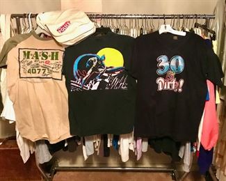 Full rack of printed t-shirts from the 1970's through the 1990's. Some great vintage iron-ons like the "30 & Dirty!". Also available is a The Police licensed messenger bag sold at concerts.