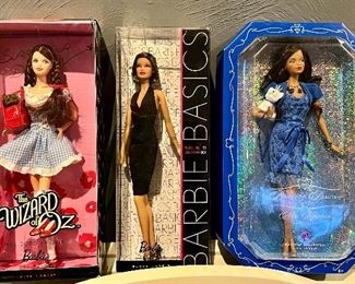 Item 248:  The Wizard of Oz Barbie Miss Dorothy Gale (left): $150                                                                                               Item 249:  Barbie Basics Pink Label (middle):  $55                                                                               Item 250:  Barbie Beauties Pink Label Miss Sapphire (right): $50