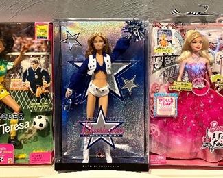 Item 256:  Soccer Teresa Barbie (left):  $15                                                                     Item 257:  Dallas Cowboy Cheerleader Barbie (middle):  $75                                                                                                                        Item 258:  A Fashion Fairytale Barbie (right): $30