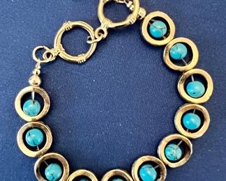 Item 281:  Silver Tone and Turquoise Colored Stone Bracelet:  $14