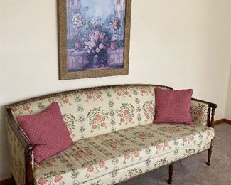 Antique sofa on wood legs,  wood trim and nail heads