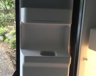 Inside of door - black refrigerator with ice & water in door