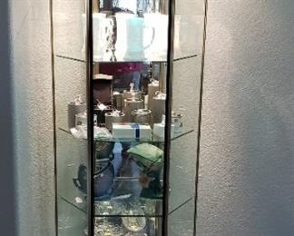 lighted glass and metal curio cabinet
SOLD