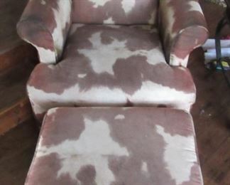 Faux cowhide chair and ottoman.