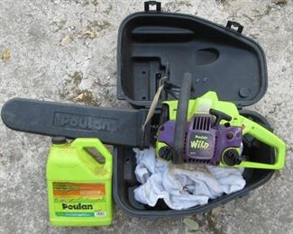 Poulan "Wild" chain saw and carring case and extra chain oil.
