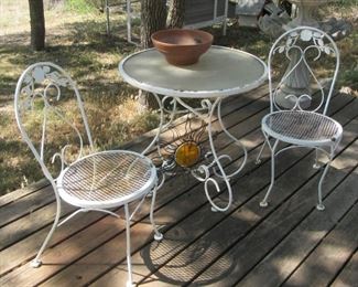 Metal outdoor furniture, plus other decorative patio items.