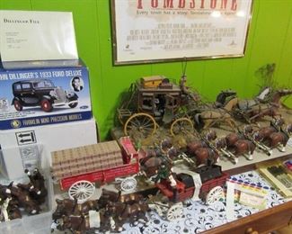 Old stagecoach display, Plastic Budweiser wagon with horses. Iron beer wagon, John Dillinger Franklin Mint model (rare find). Lots more.