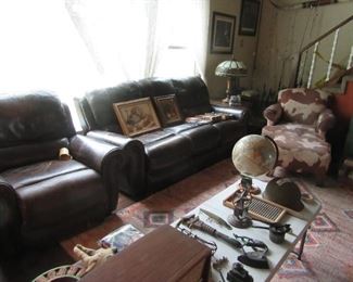 Front room, couch/chair/lamps/ lots of collectible items.