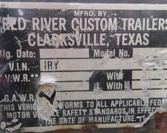Trailer ID tag. on Red River trailer. You get boat, motor and trailer with NO title. Selling as is, where is. NO guarantee or warranty.