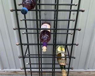 Swanky Mid Century era cast iron wine bottle rack with ball tips 