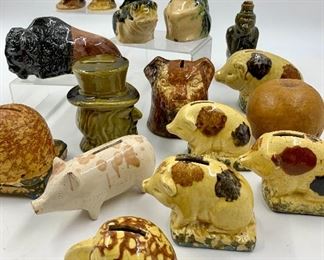 Large assortment of early earthenware pottery banks and monkey bottle