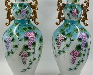 Pair of large sized hand painted Dresden porcelain hall vases with gilded handles, marked on the underside 
