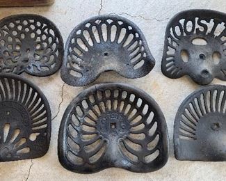 Assorted cast iron antique Tractor Seats 