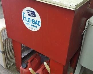 Flo Bac parts washer, vintage Napa cover, rims, and gas cans.