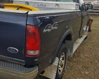2003 Ford F150 4x4 Truck with V Boss plow, and Snow Ex Spreader , also has a stainless steal Delta Champion Tool Box, new battery. One owner. Mileage&nbsp;92140.6