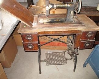 vintage treadle sewing table, this one with machine, others without sewing machine. Many possibilities to re-purpose