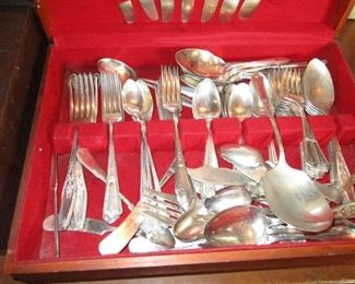 a few wooden boxes with very vintage stainless silverware.