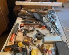 variety of tools, many vintage, saws and fishing poles, tool boxes, etc
