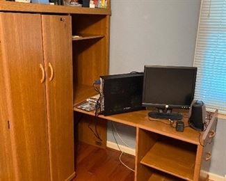 Desk. Right side rolls into cabinet for storage