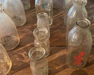 Several Old Milk Bottles
