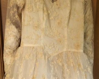 Absolutely stunning wedding dress circa 1956 this is an absolutely beautiful dress with layers of tulle and embroidered floral.  Also has original veil. 