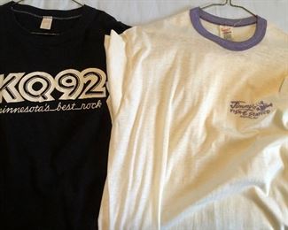 assortment of vintage clothing in a variety of conditions from worn to new. 