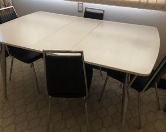 Very nice Formica and chrome table and chairs, chairs are in excellent condition, no rips, chrome is not rusty this is a great retro set.