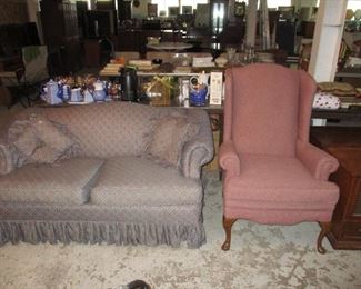 loveseat and wing back chair