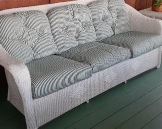Lloyd Loom wrapped - wicker sofa.  very good condition The other table is classic vintage wicker. 
