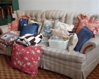 view of sofa in basement  Most of the pillows moved to master bedroom
