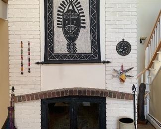 Living Room 
Tapestry from Kenya/Zimbabwe, Rooster mask-Puerto Rico, copper pail, stoneware crock
