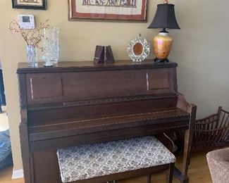 Living Room 
Piano, Artwork from Egypt, Stone bookends, art glass lamp