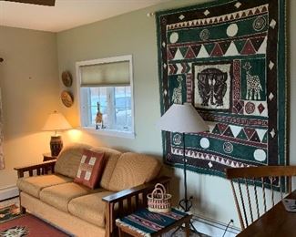 Family Room 
Reupholstered Mission style sofa, large wall hanging 