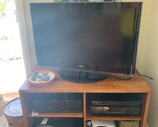 Family Room 
Cherry tv console(most likely Stickley as it matches the bookcases in the living room), LG tv, Kenwood Receiver(KR-V5580), JVC DVD player, Kenwood CD-404 5 disc player, HP envy photo 7855 printer