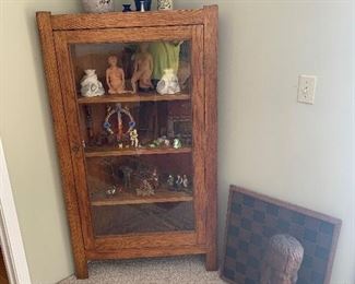 Family Room 
Corner cabinet, pottery, figurines, wood animals, chess board, carved wooden head