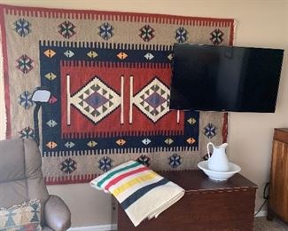 Primary Bedroom 
Kilim rug, early blanket chest, Early’s of Witney wool blanket(Hudson Bay style), wash bowl & pitcher set, Samsung Smart tv