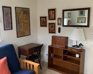Bedroom Two 
Sewing machine stand w/ machine
Bookcase, duck lamp, wooden mirror, Artwork from Kenya/Tanzania 