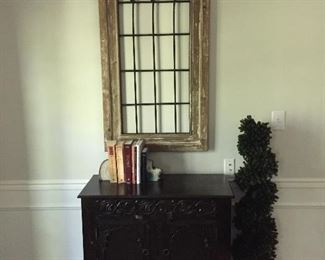 Really cool cabinet and gothic arch hanging.