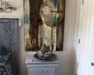 Cool wall art and cute bedside table.