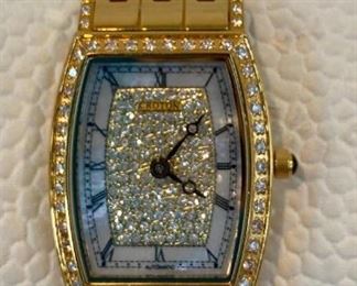 Ladies Croton Gold Tone Sapphire Crystal Watch