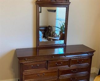 One of 2 beautiful dressers with mirrors.