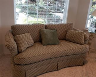 Slightly curved comfortable sofa, Larger than a love seat, small than a couch typically
