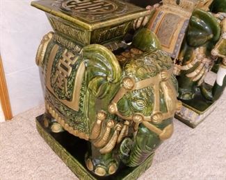 one of two green and gold elephant stools