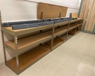 Heavy duty metal & wood deck shelving. There are 4 36x18" deep three tier shelves and 5 36x 24" shelves.